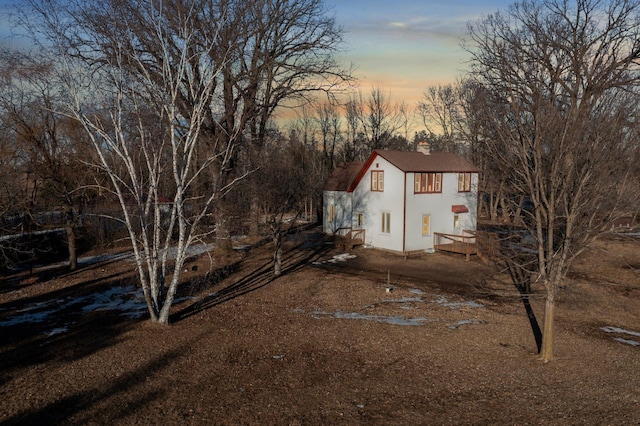 view of property exterior at dusk