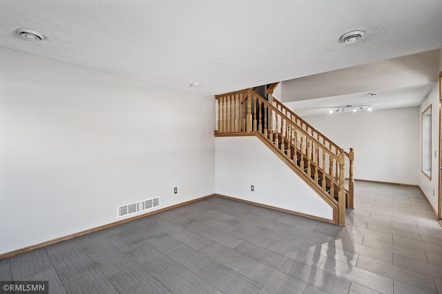 interior space featuring a textured ceiling