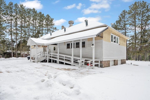 view of snow covered house