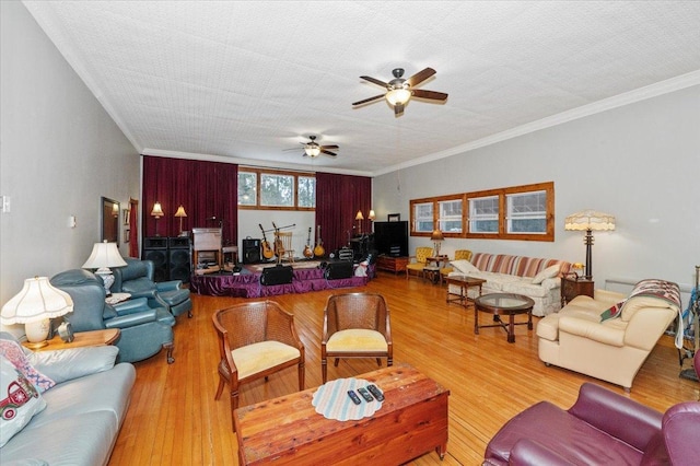 living room featuring ornamental molding, a textured ceiling, and hardwood / wood-style floors