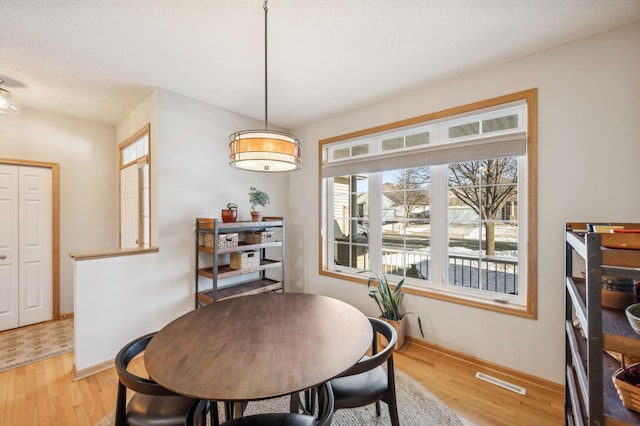 dining room featuring light wood-type flooring