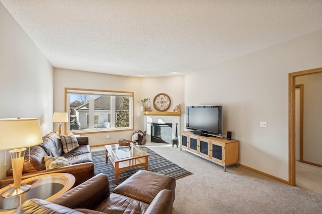 carpeted living room featuring a textured ceiling