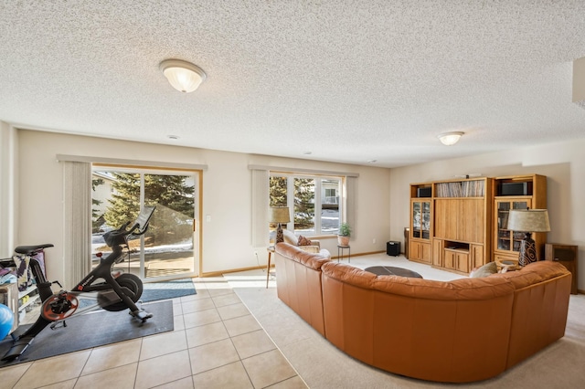 living room featuring light tile patterned floors and a textured ceiling