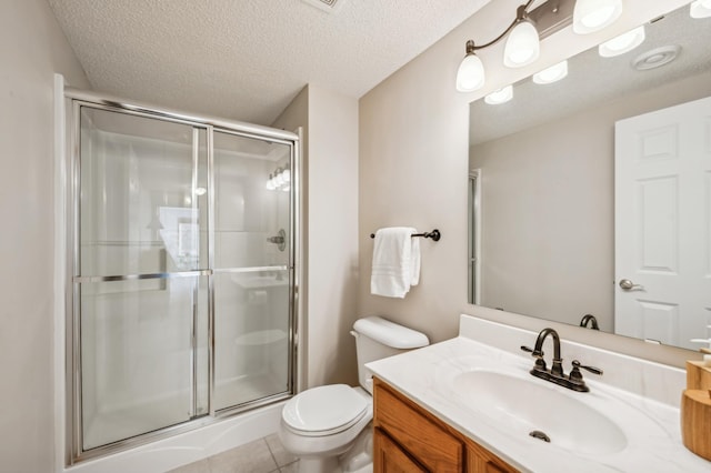 bathroom with walk in shower, vanity, toilet, and a textured ceiling