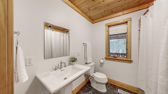 bathroom featuring wood ceiling and toilet