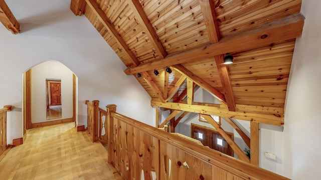 hallway with wood ceiling, beam ceiling, high vaulted ceiling, and light wood-type flooring