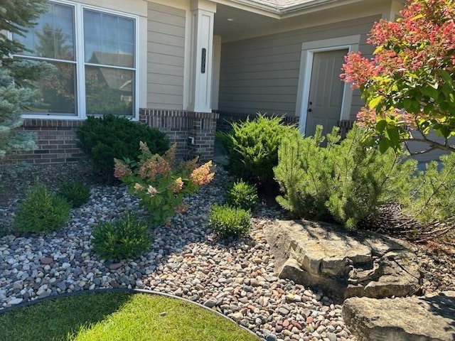 entrance to property with brick siding