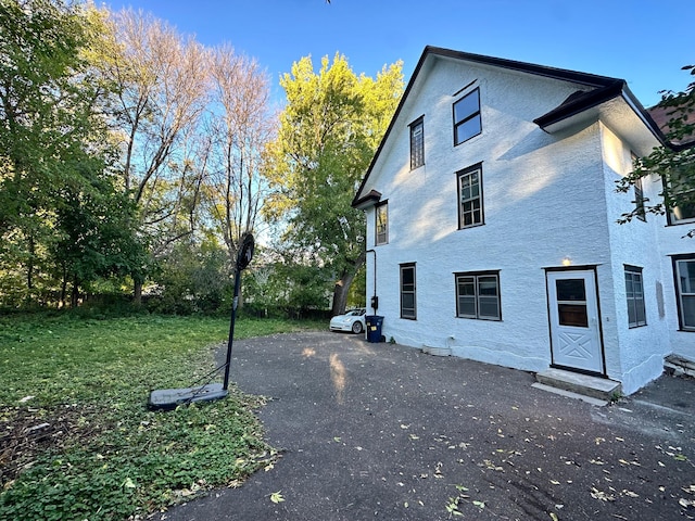 view of home's exterior featuring a yard