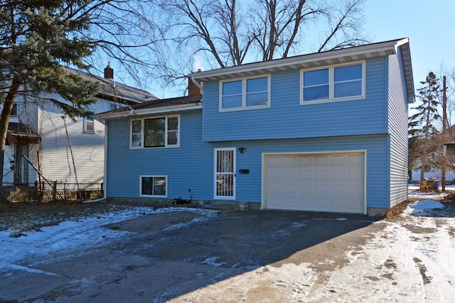 split level home with a garage