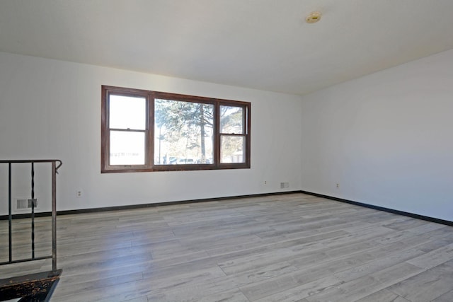 unfurnished room featuring light hardwood / wood-style floors