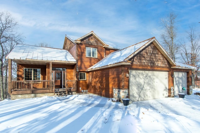 view of front of property with a porch and a garage