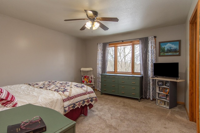 bedroom with ceiling fan and light colored carpet