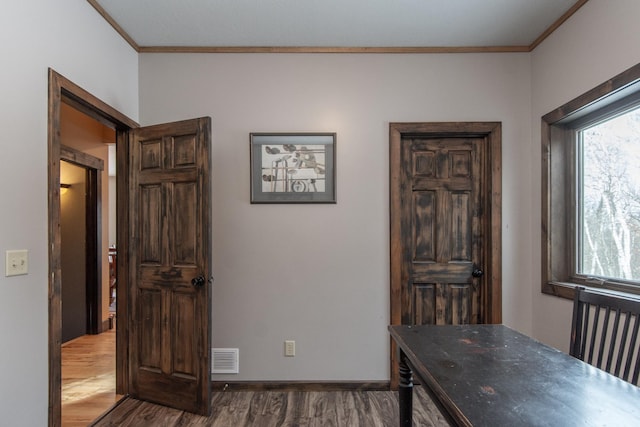 office space with ornamental molding and dark hardwood / wood-style flooring