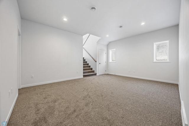 unfurnished living room featuring carpet