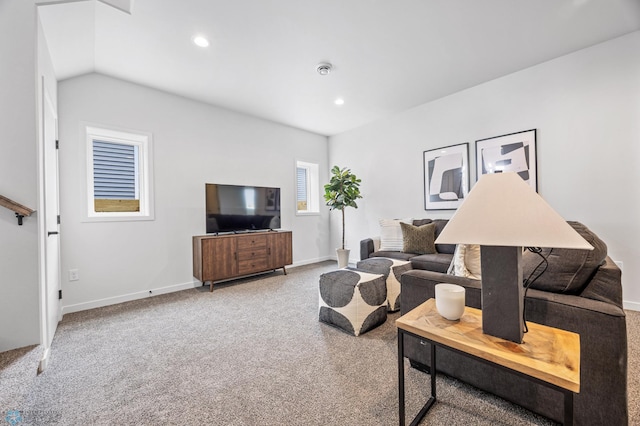 carpeted living room featuring baseboards, recessed lighting, and lofted ceiling