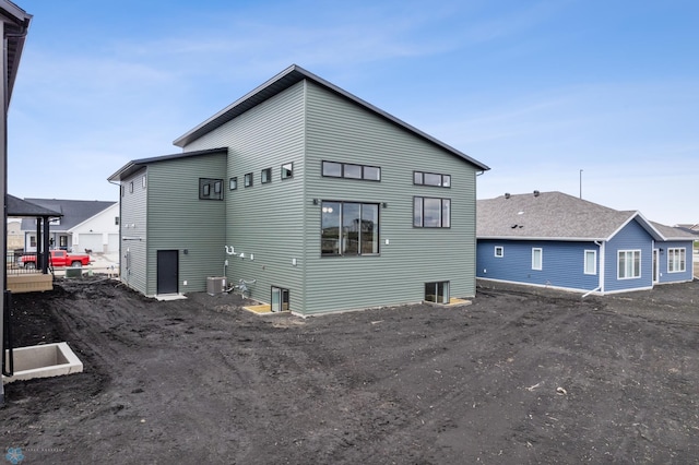 rear view of house with central air condition unit