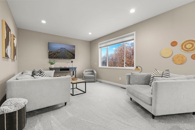 living room with light carpet, baseboards, and recessed lighting