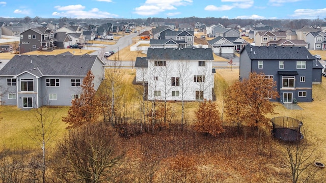 birds eye view of property with a residential view