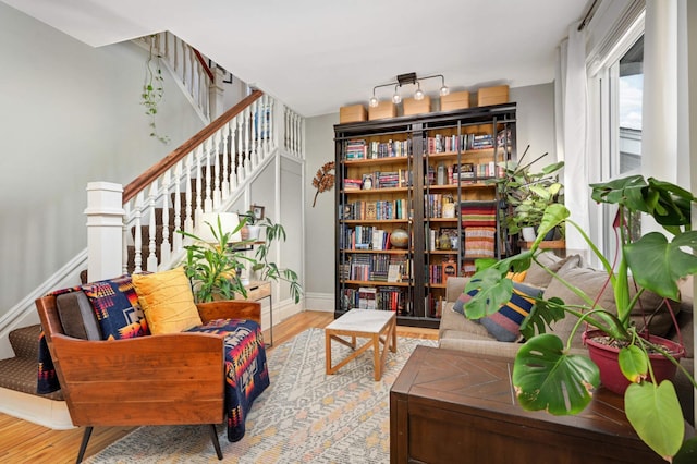 living area with hardwood / wood-style flooring