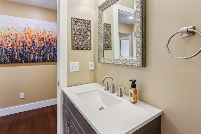 bathroom featuring vanity and hardwood / wood-style floors