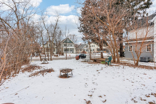 snowy yard with central air condition unit