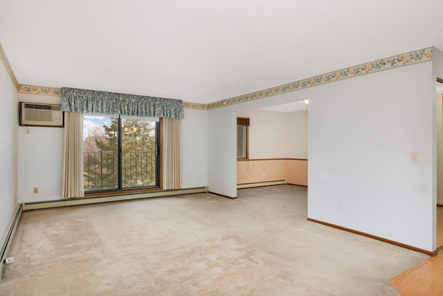 spare room featuring a wall mounted air conditioner, carpet floors, and a baseboard heating unit