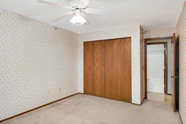 unfurnished bedroom featuring ceiling fan and light carpet