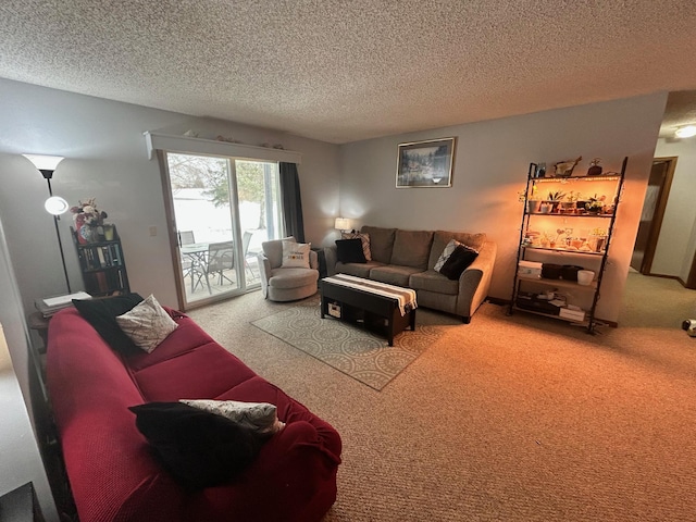 living room with carpet floors and a textured ceiling