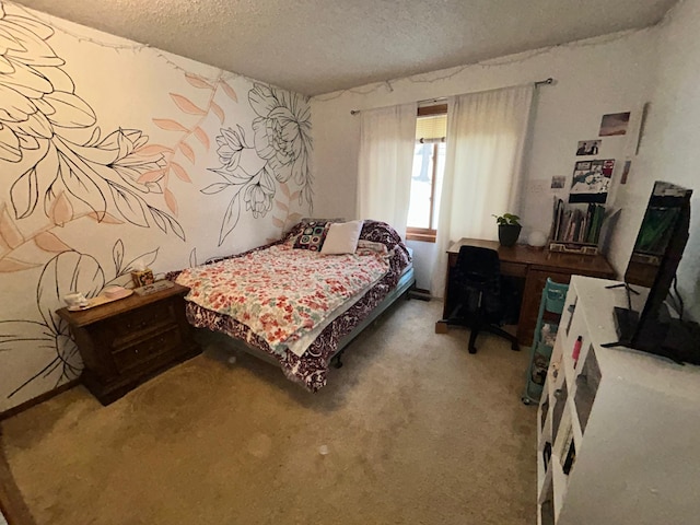 bedroom featuring carpet floors and a textured ceiling