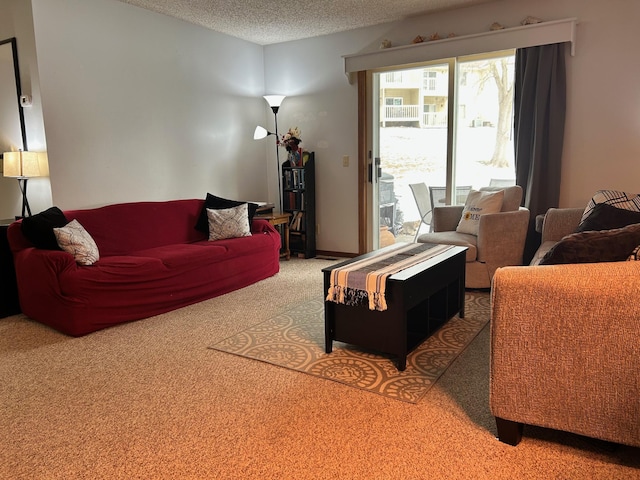 carpeted living room featuring a textured ceiling