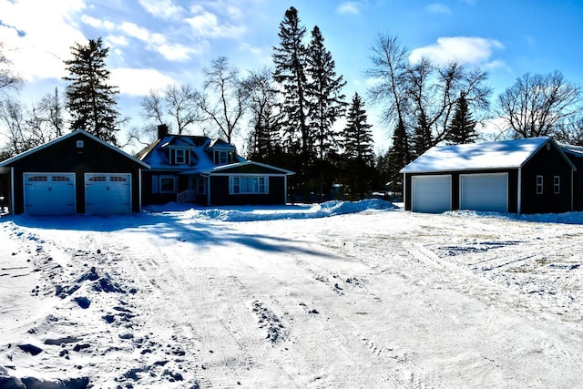 exterior space with an outbuilding and a garage