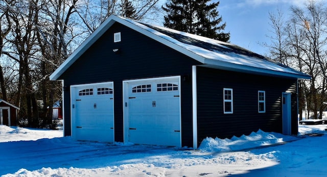 view of snow covered garage