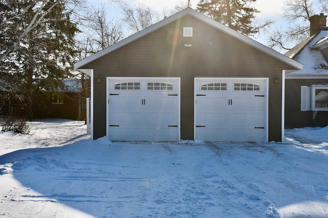 view of snow covered garage