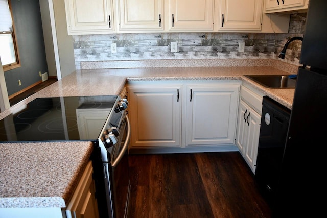 kitchen with white cabinetry, sink, dark hardwood / wood-style floors, and black appliances