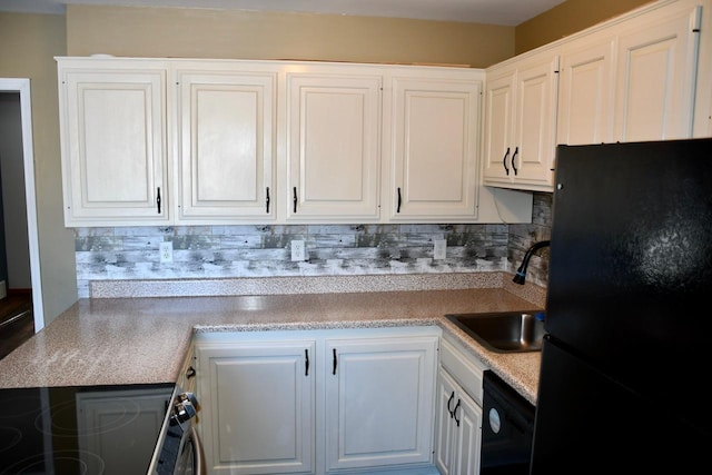 kitchen with sink, decorative backsplash, black appliances, and white cabinets