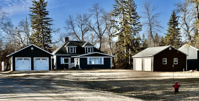 1510 Cartway Dr, Thief River Falls, MN 56701 - view of front of house featuring a chimney and a garage