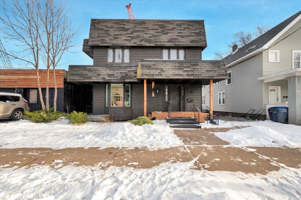 view of front property featuring covered porch