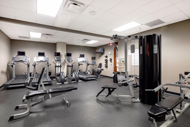 workout area with a drop ceiling