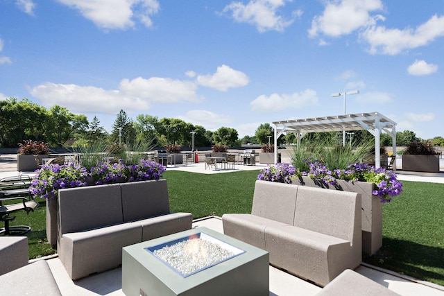 view of patio / terrace featuring a pergola and an outdoor living space with a fire pit