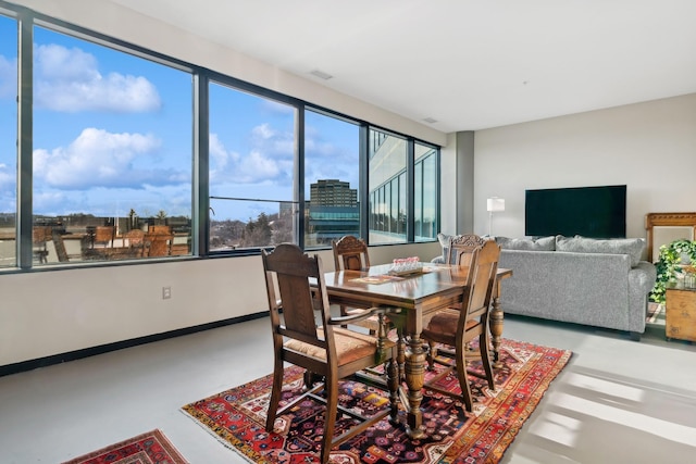 dining space with concrete floors