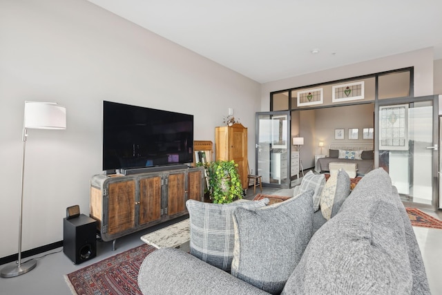 living room with concrete flooring