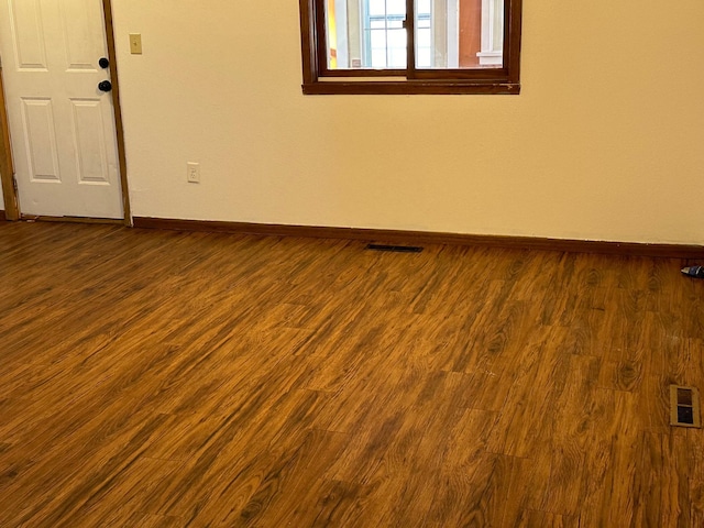 unfurnished room featuring wood-type flooring