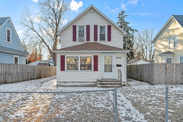 view of snow covered rear of property