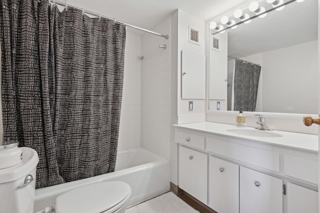 full bathroom with shower / tub combo with curtain, vanity, and toilet