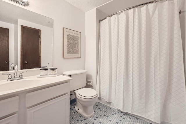 bathroom featuring vanity, a textured ceiling, tile patterned floors, toilet, and walk in shower