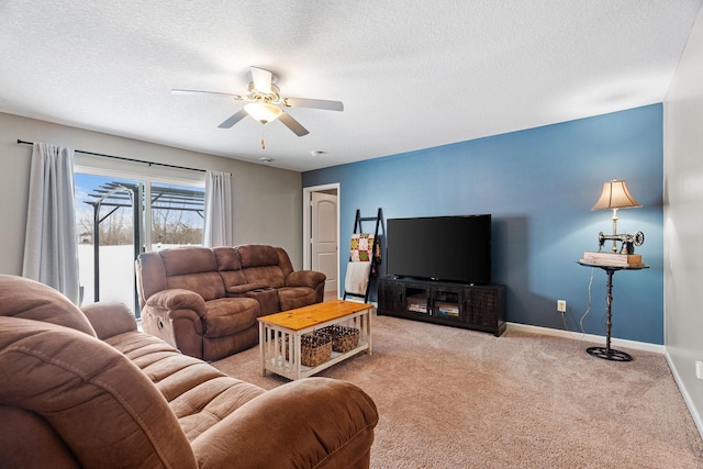 carpeted living room with a textured ceiling and ceiling fan