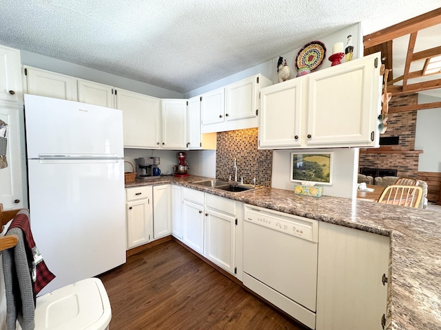 kitchen with white cabinetry, white appliances, dark wood-style floors, and a sink