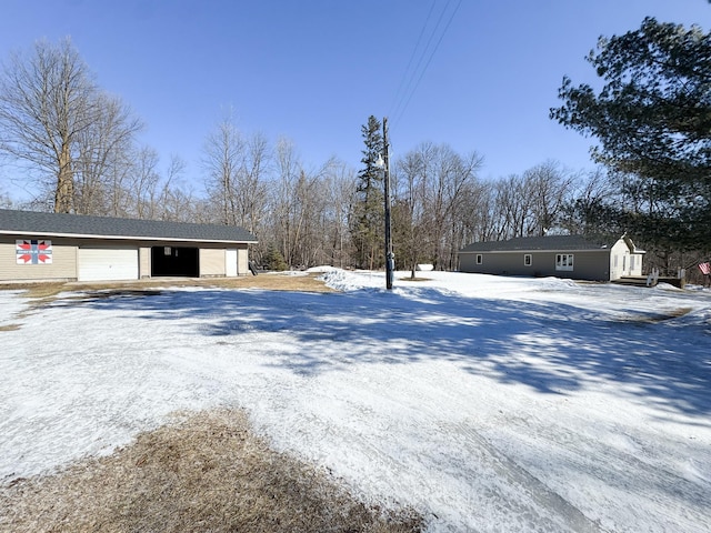 exterior space with a detached garage