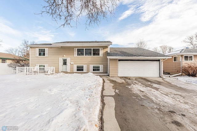 bi-level home featuring a garage