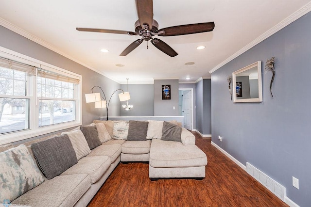 living room featuring crown molding, dark hardwood / wood-style floors, and ceiling fan